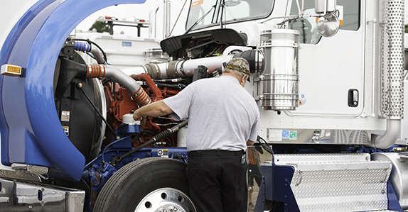 Inspecting truck tractors for sale at Ritchie Bros.
