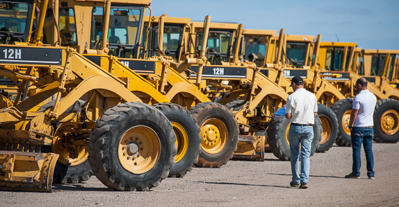 Motor graders waiting for auction day